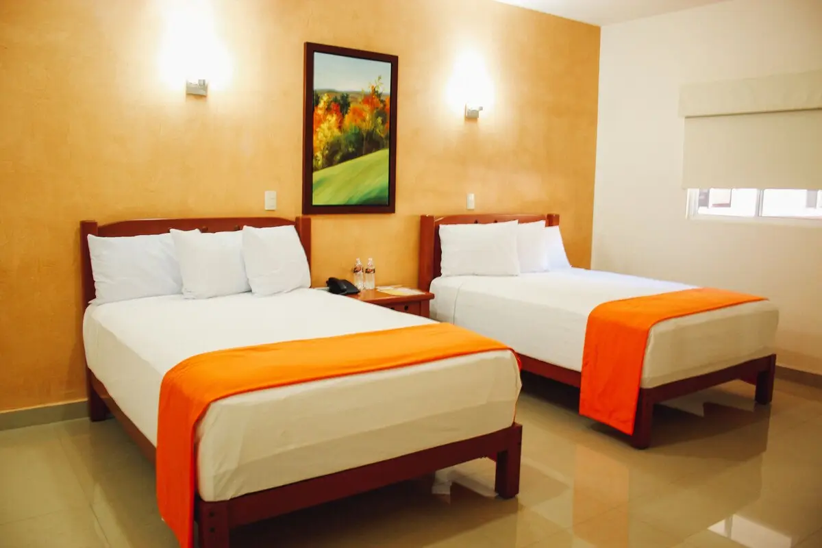 Room with two full beds at Gran Hotel Residencial Galerias